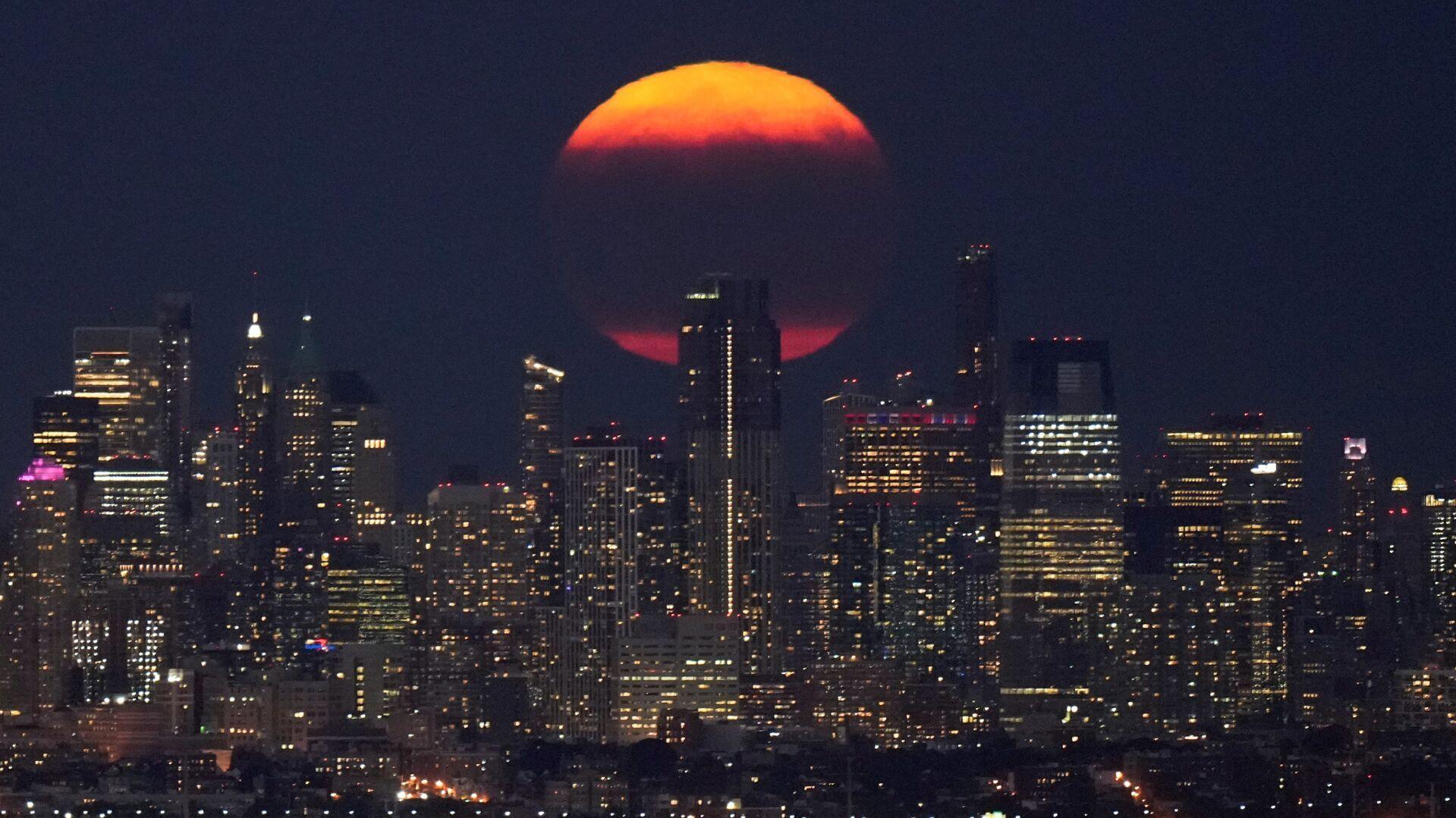 Photos: The first supermoon in August rises around the world